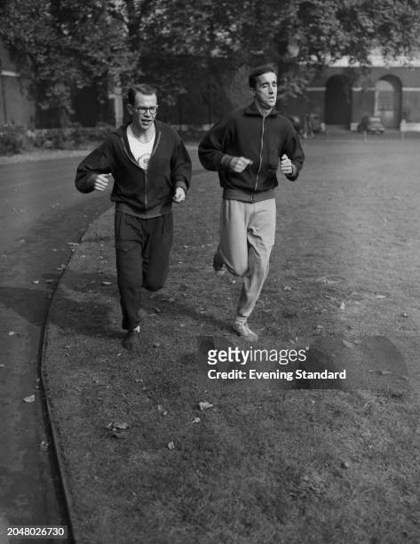 British track athletes Gordon Pirie right, and Chris Brasher on a run during training, October 10th 1955.