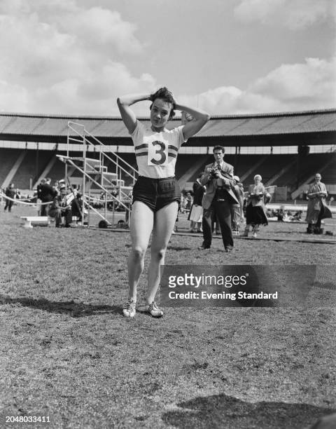 Track and field athlete June Foulds during an AAA Championships at White City Stadium, London, July 1956.