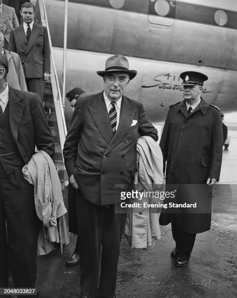 Australian Prime Minister Robert Menzies arrives in London to attend a conference on the Suez Crisis, August 10th 1956.