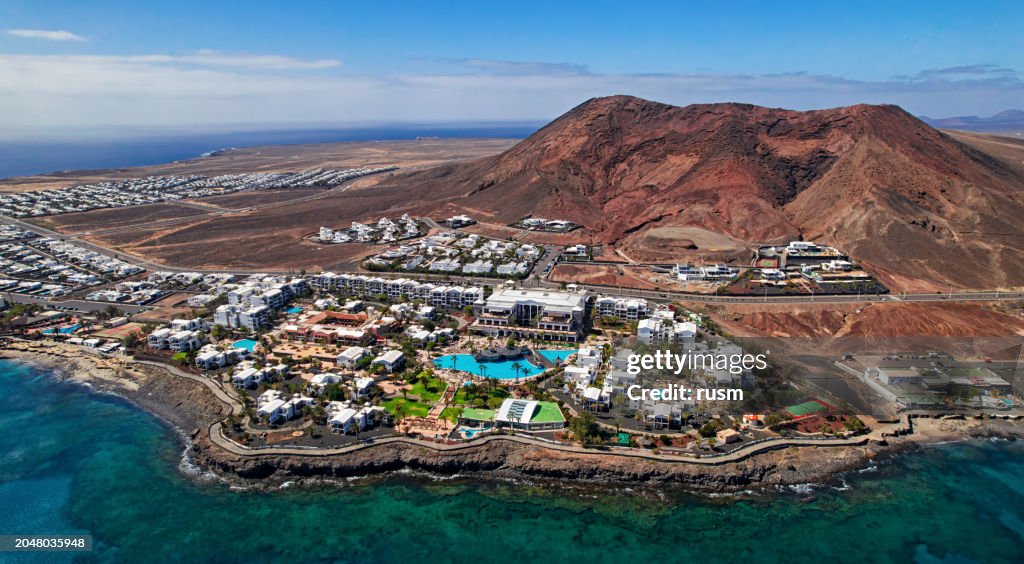 Aerial view of Playa Blanca and Montana Roja, Lanzarote, Canary islands, Spain