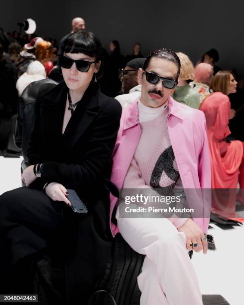 Olivia Singer and LUCKY LOVE attend the Acne Studios Womenswear Fall/Winter 2024-2025 show as part of Paris Fashion Week on February 28, 2024 in...