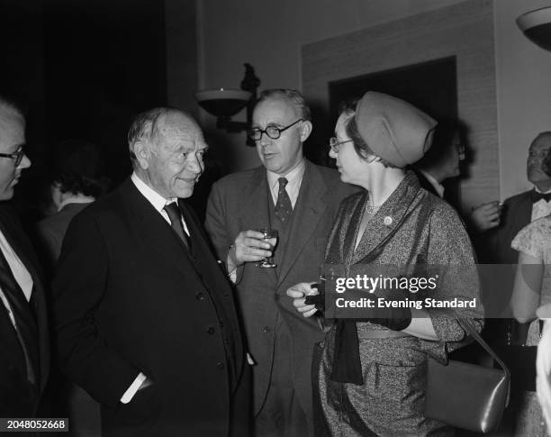 Newspaper publisher and author Max Aitken, 1st Baron Beaverbrook , left, with Rhodes Professor of Imperial History, Gerald S Graham and his wife...