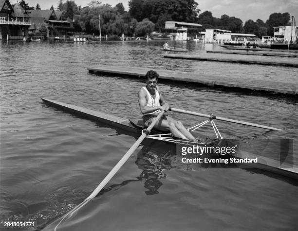 Sculler Sidney Rand sitting in his his scull boat, Henley Royal Regatta, Oxfordshire, July 2nd 1955.