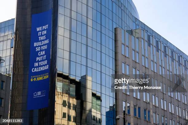 Giant Banner that says: 'We put it on the building so you can put it in your calendar' to push people to vote for the European Legislative election...