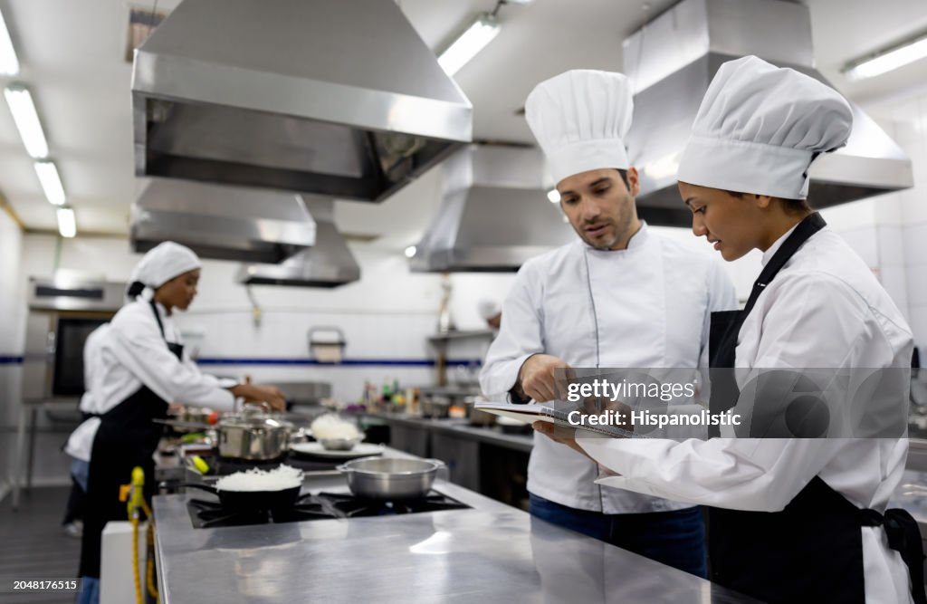 Chef talking to a student in a cooking class