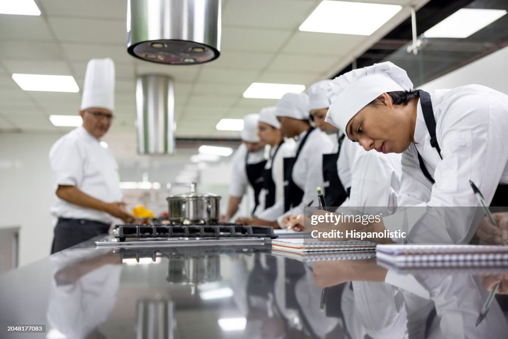 Cooking Class Notes Group Of Students Taking Notes In A Cooking Class High-Res Stock Photo ...