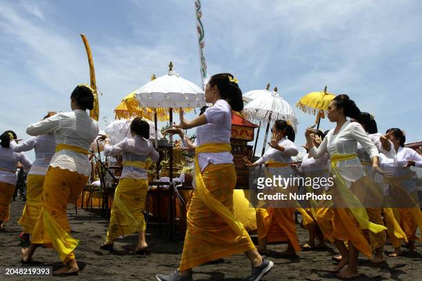 Hindu devotees are performing dances during the Melasti ritual ceremony at Parangkusumo Beach, Bantul, Yogyakarta, Indonesia, on March 3, 2024. The...