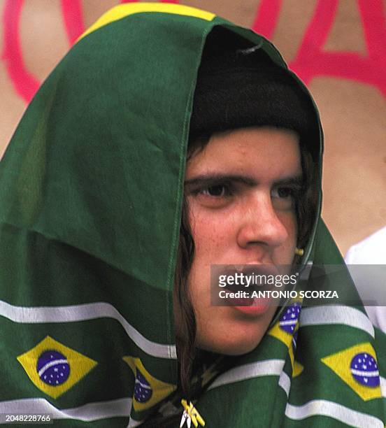 Student, covered with a flag in the Brazilian colors, participates in a political demonstration in Rio de Janeiro on August 22, 2001. The students...