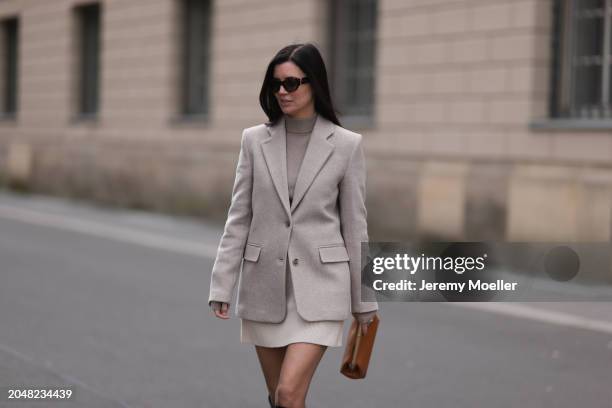 Leo Eberlin seen wearing YSL brown tortoise sunglasses, Leo Mathild diamond jewelry / diamond rings, Allude x Leo Mathild beige cashmere wool knit...