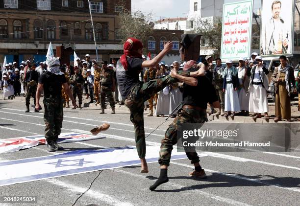 Yemen's Houthi fighters perform self-defense skills during a parade staged in solidarity with Palestinians and against Israel's war on the people of...