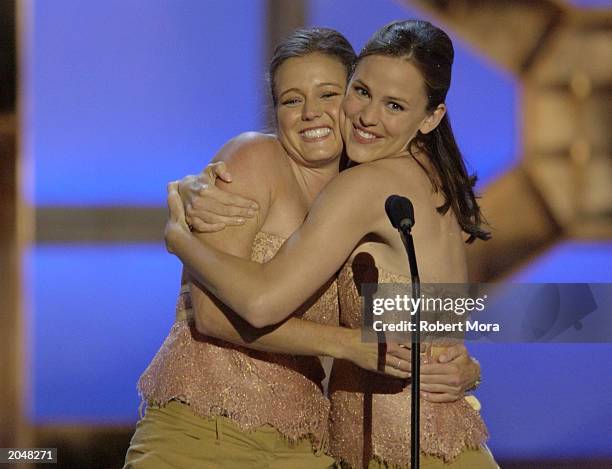 Actress Jennifer Garner and her stunt double Shanna Duggins present the "Best Overall Stunt by a Woman" award on stage during the 3rd Annual Taurus...