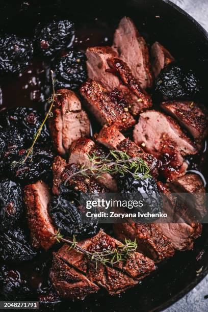 roasted duck breast with prunes - dried plum stock pictures, royalty-free photos & images