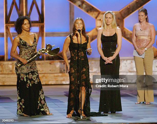 Stuntwoman Jamie Blake accepts the "Best Overall Stunt by a Woman" award with Nikki Berwick and Amanda Foster during the 3rd Annual Taurus World...