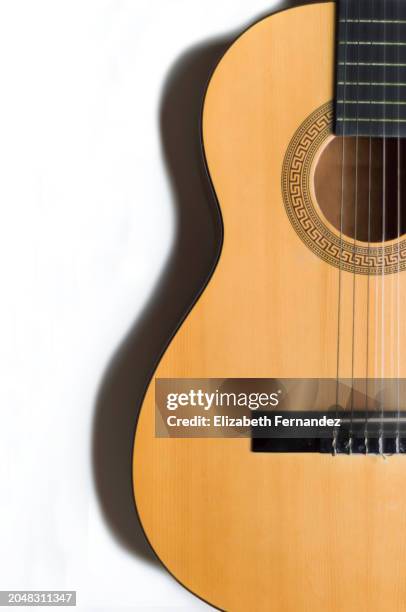 acoustic guitar on white background, copy space on image - acoustic guitar white background stock pictures, royalty-free photos & images
