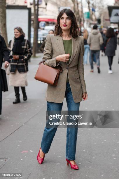 Jeanne Damas wears green top, beige checked blazer, jeans, brown bag, red heels, outside Dries Van Noten, during the Womenswear Fall/Winter 2024/2025...
