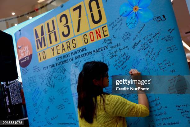 Relatives of passengers from the Malaysia Airlines flight that mysteriously vanished 10 years ago are writing messages at the Day of Remembrance for...