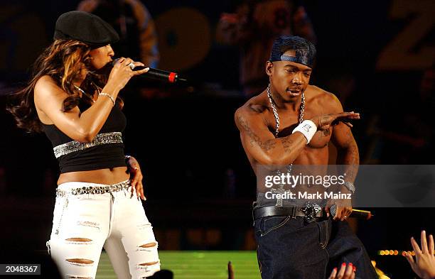 Singer Ashanti and rapper Ja Rule perform during "Z100's Zootopia 2003 Concert" June 1, 2003 at Giant Stadium in East Rutherford, New Jersey.