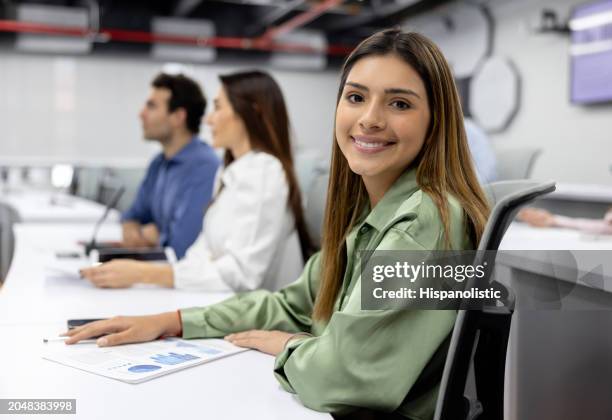 happy mba student smiling in the classroom - master of business administration stockfoto's en -beelden
