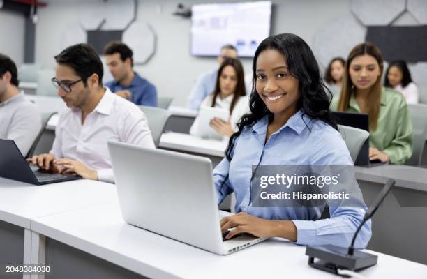 happy mba student smiling in the classroom - master of business administration stock pictures, royalty-free photos & images