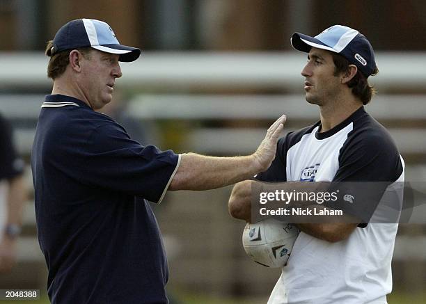 Coach Phil Gould talks with captain Andrew Johns during State of Origin training June 2, 2003 for the New South Wales Blues held at Coogee Oval in...