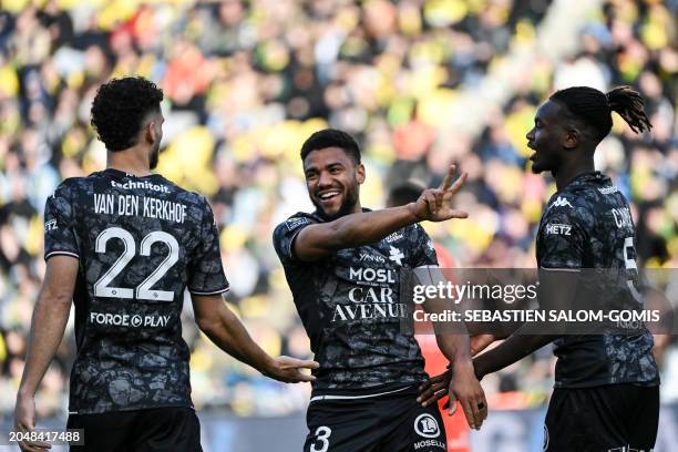 Metz's French defender Matthieu Udol celebrates with teammates after scoring his team's second goal during the French L1 football match between FC...