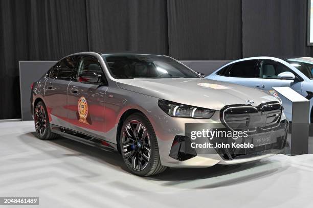 I5 M60 xDrive Sedan EV electric vehicle a finalist in the Car of The Year is displayed during the Geneva Motor Show 2024 at Palexpo on February 26,...