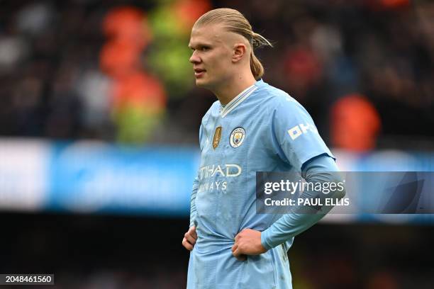 Manchester City's Norwegian striker Erling Haaland looks on during the English Premier League football match between Manchester City and Manchester...