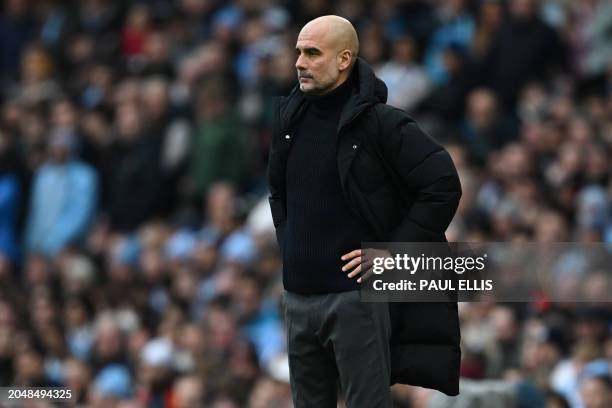 Manchester City's Spanish manager Pep Guardiola looks on during the English Premier League football match between Manchester City and Manchester...