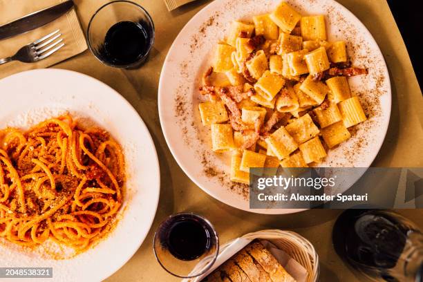 italian pasta served in a restaurant, rome, italy - carbohidrato fotografías e imágenes de stock