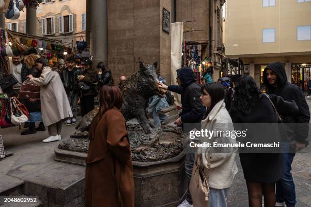 Man rubs the nose of the so called "Porcellino", a bronze fountain of a wild boar on February 29, 2024 in Florence, Italy. The historic centre of...