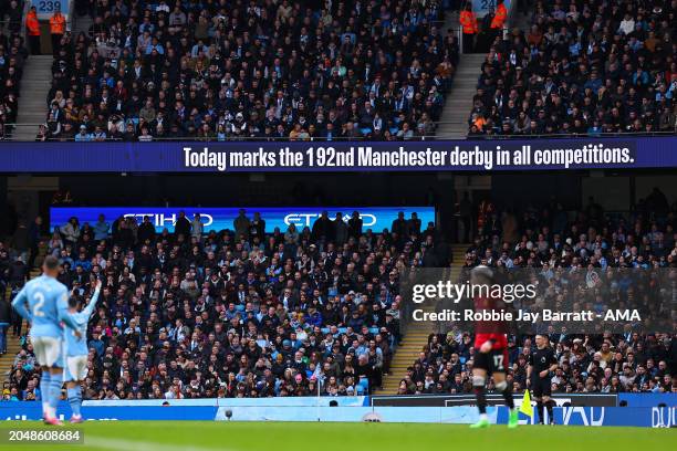 General view inside the Etihad Stadium as an electronic screen message announces that today marks the 192nd Manchester derby in all competition...