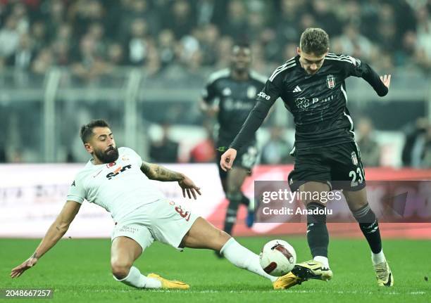 Ernest Muci of Besiktas and Kerem Demirbay of Galatasaray compete during the Turkish Super Lig 28th week match between Besiktas and Galatasaray at...