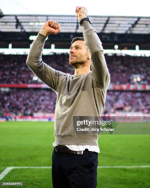 Headcoach Xabi Alonso of Leverkusen reacts to the fans after the Bundesliga match between 1. FC Köln and Bayer 04 Leverkusen at RheinEnergieStadion...