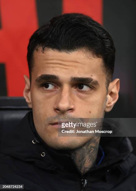 Gianluca Scamacca of Atalanta looks on from the bench prior to kick off in the Serie A TIM match between AC Milan and Atalanta BC at Stadio Giuseppe...
