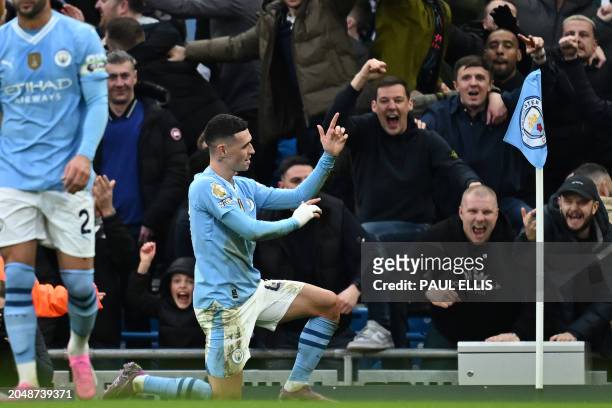 Manchester City's English midfielder Phil Foden celebrates after scoring their second goal during the English Premier League football match between...