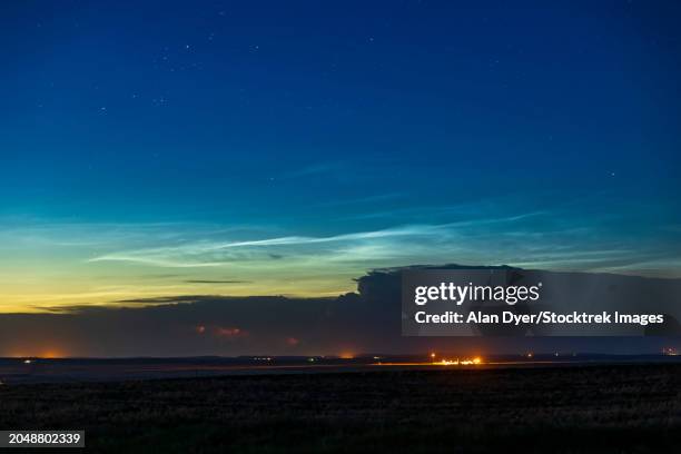 noctilucent clouds above a thunderstorm in southern alberta, canada - troposphere stock pictures, royalty-free photos & images