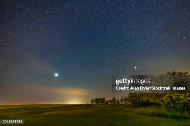 jupiter and saturn low in the southeast sky in southern alberta, canada - constellation pegasus stock pictures, royalty-free photos & images