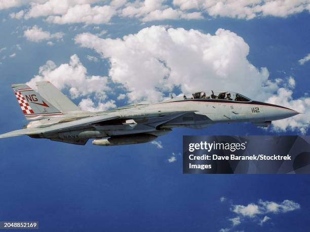 colorful f-14 tomcat flying among puffy clouds - 1996 stock pictures, royalty-free photos & images