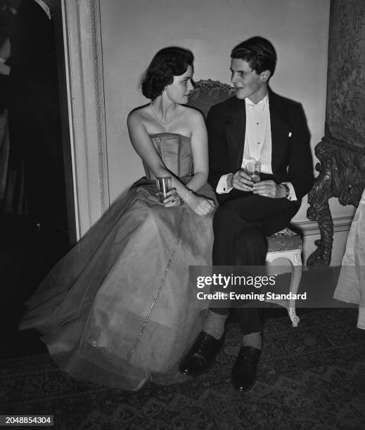 Frances Sweeny and Alexander Thynn, Viscount Weymouth seated together at a social event, March 8th 1956.