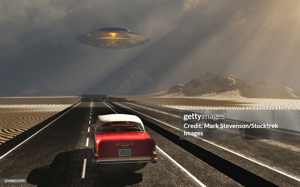 A classic chevrolet car having a close encounter with a UFO on a remote desert road