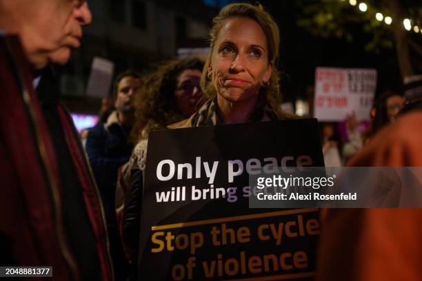 Protestor holds a sign that reads, "only peace will bring security" while calling for a ceasefire and condemn the death of over 100 people killed in...
