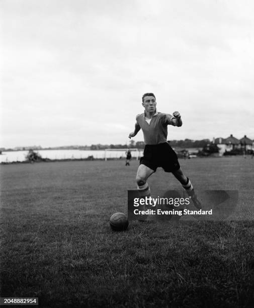 Chelsea Football Club striker Jimmy Greaves dribbling with a football during pre-season training, August 21st 1957.