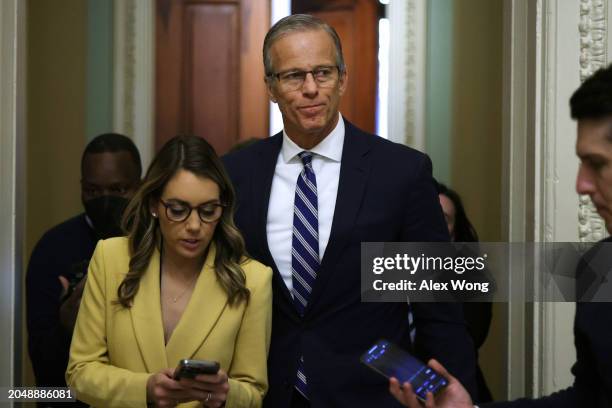 Senate Minority Whip Sen. John Thune talks to members of the press as he walks in a hallway at the U.S. Capitol on February 29, 2024 in Washington,...