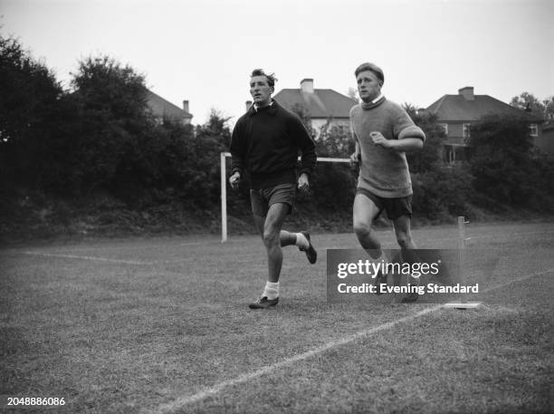 Tottenham Hotspur Football Club midfielder Tony Marchi and winger Terry Medwin running during pre-season training, August 14th 1957.