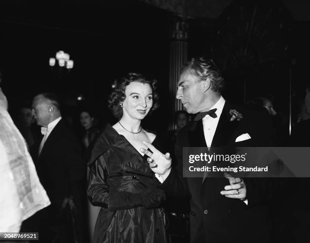 Actress Pamela Brown and Belgian artist Paul Haesaerts at a social event, June 27th 1955.