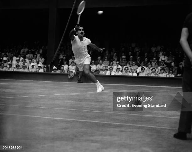 Indian tennis player Naresh Kumar plays an overhead volley during the third round of the Men's Singles tournament at the Wimbledon Championships,...