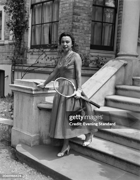 Argentine tennis player María Teran Weiss holding her racket, London, June 1955. Weiss was competing in the first round of the Women's Singles...