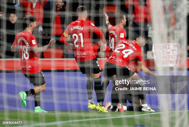 Mallorca's players celebrate the opening goal scored by Real Mallorca's Spanish defender Jose Manuel Arias Copete during the Spanish league football...