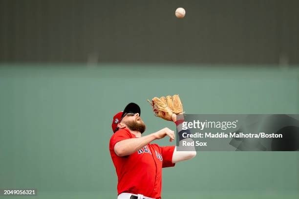 Trevor Story of the Boston Red Sox catches a fly ball during a Grapefruit League Spring Training game against the Toronto Blue Jays at JetBlue Park...