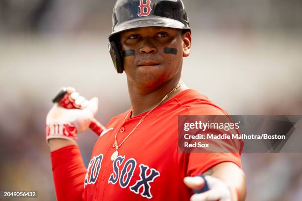 Rafael Devers of the Boston Red Sox looks on during a Grapefruit League Spring Training game against the Toronto Blue Jays at JetBlue Park at Fenway...